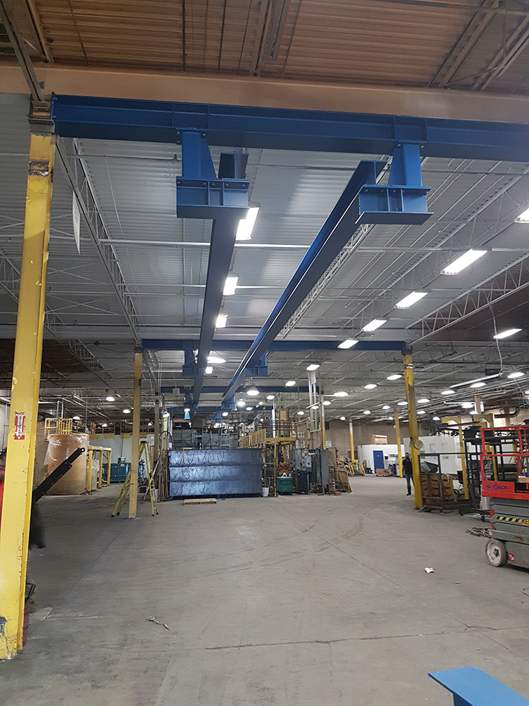 blue and yellow steel framing in manufacturing room