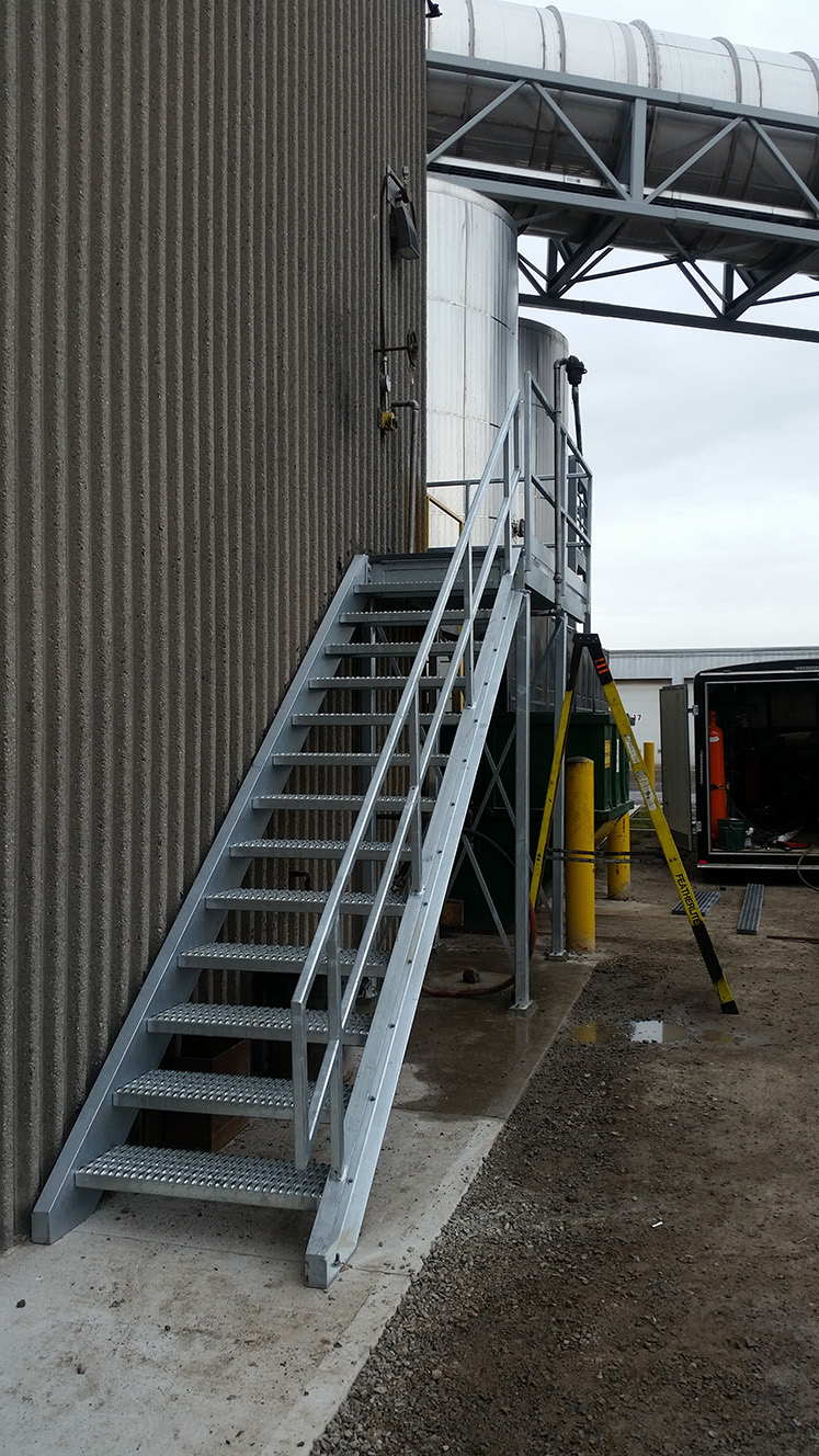 steel stairs leading to metal container room