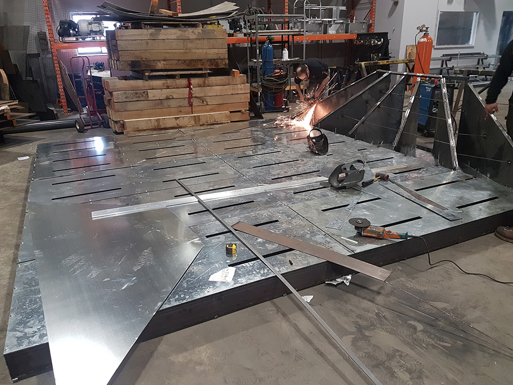 metal platform with triangle being welded