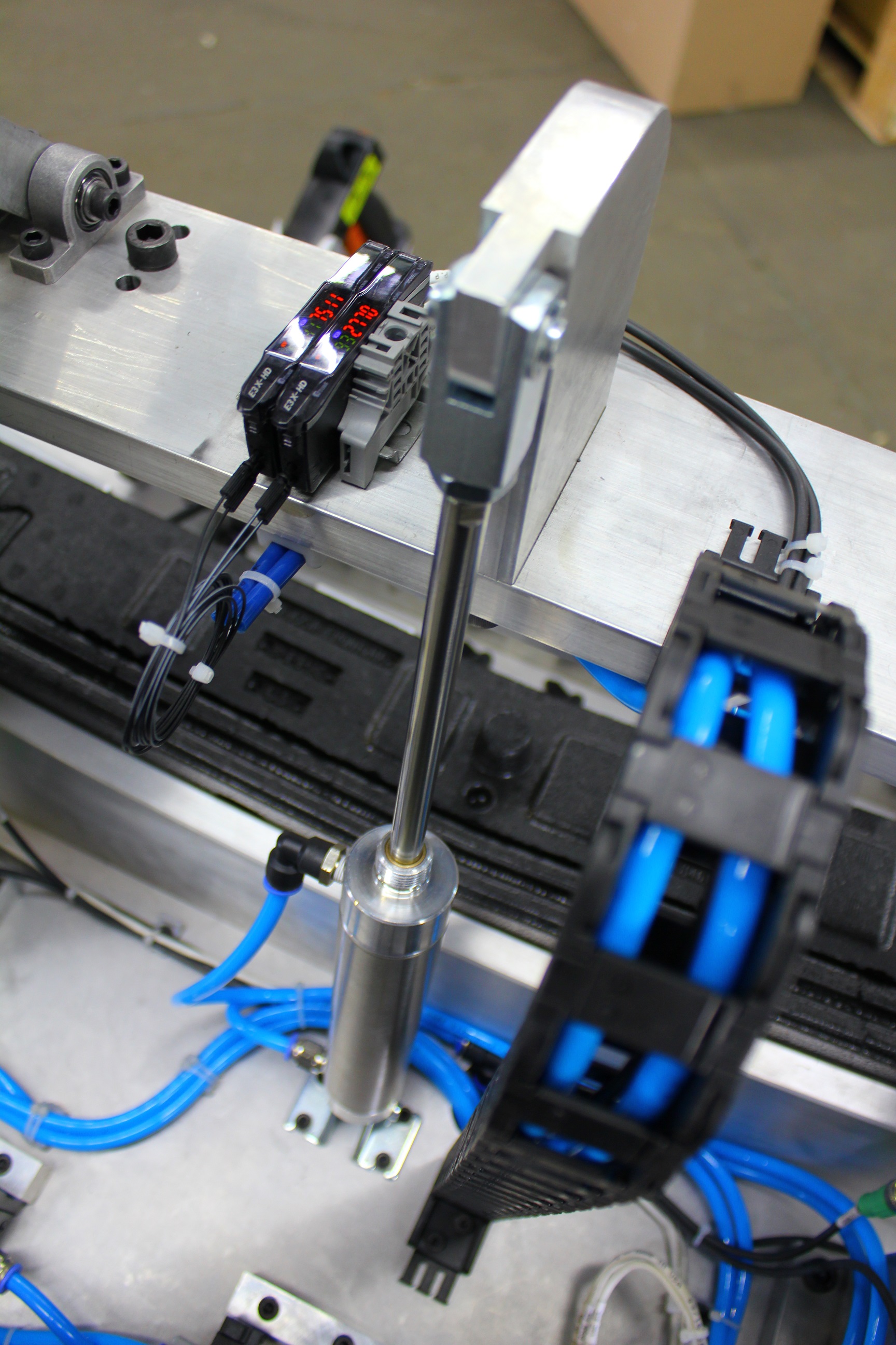 closeup with blue wires and black and steel machine