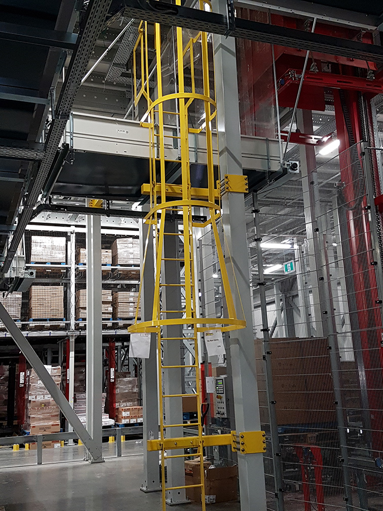 interior with steel racks full of inventory with yellow pipes