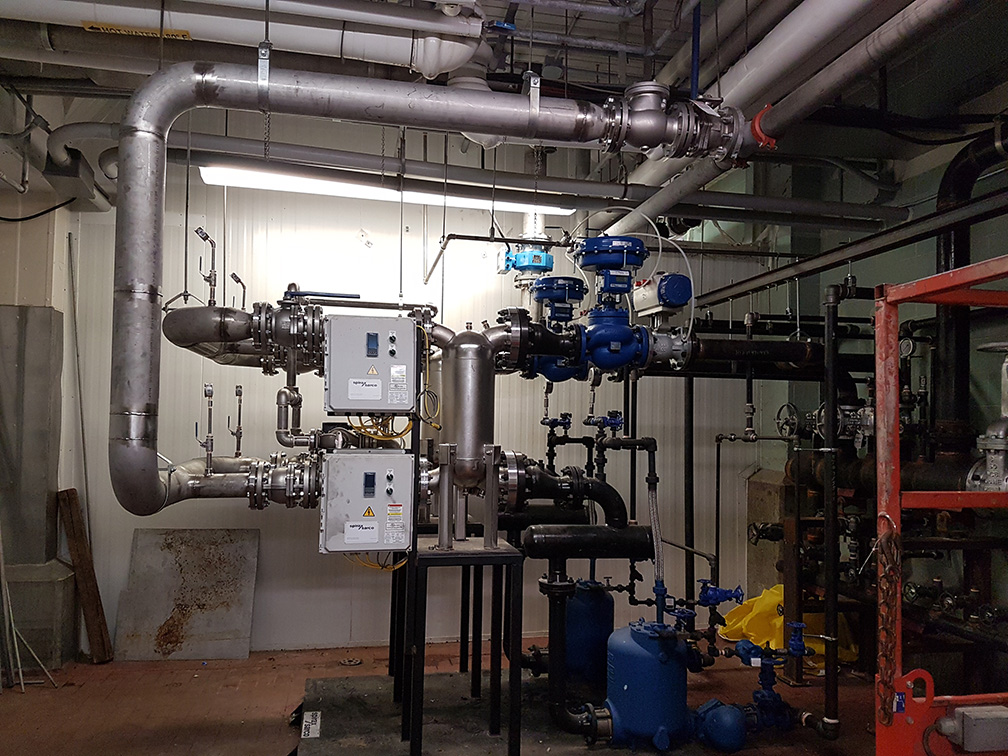 silver and blue pipes in boiler room 2