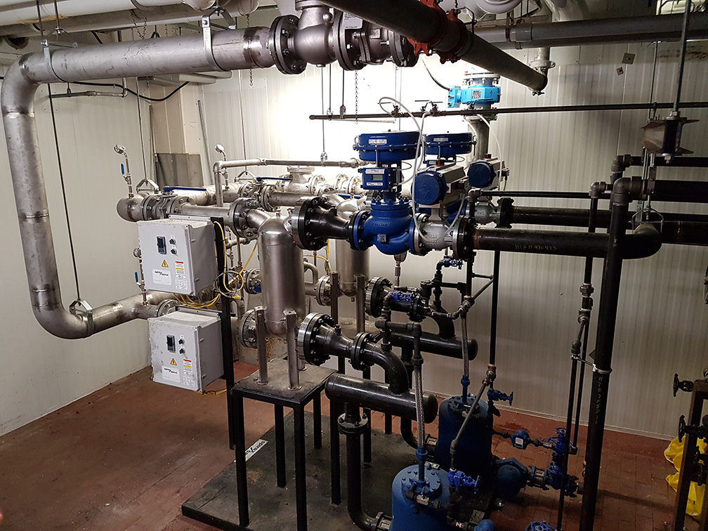 silver and blue pipes in boiler room