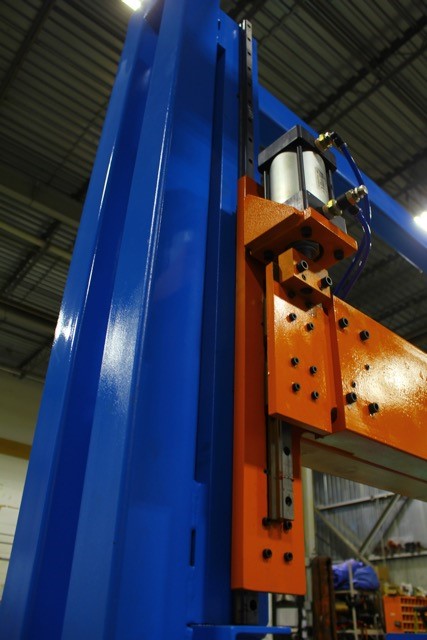steel blue and orange machine with nuts and bolts