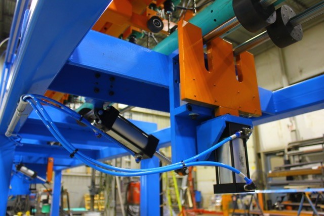 closeup machine with blue and orange steel